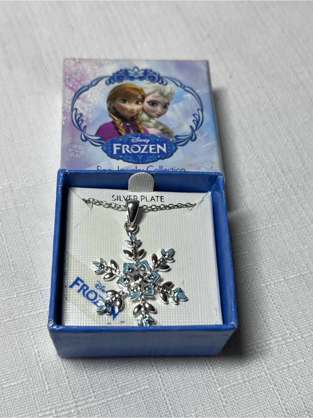 Disney Frozen Silver-Plated Blue Snowflake Pendant Necklace
New
Box included